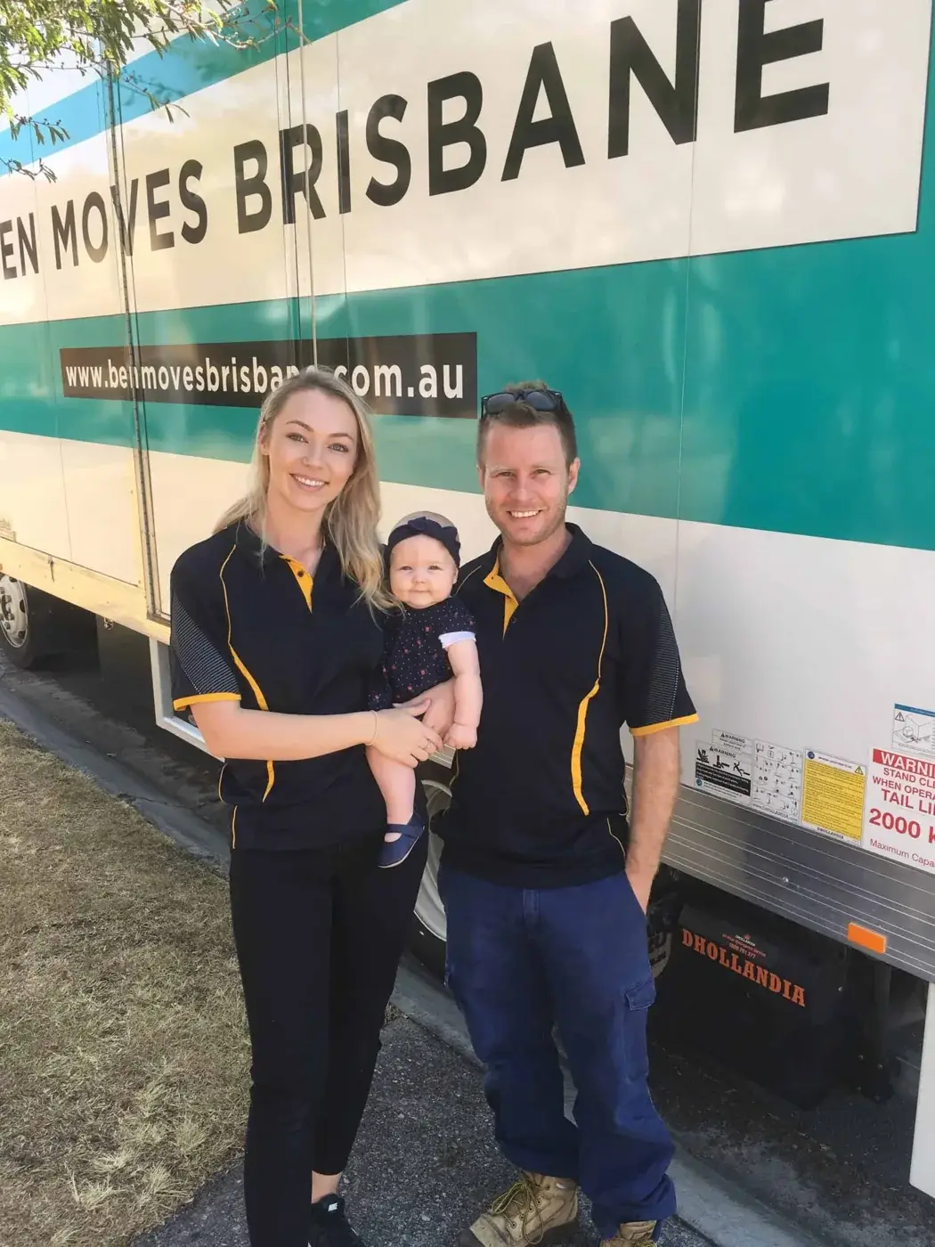 Ben and Jennie with their child beside a Ben Moves Brisbane truck