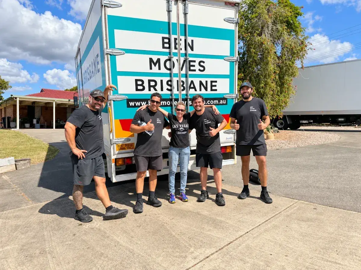 Five people from the Ben Moves Brisbane team beside a truck