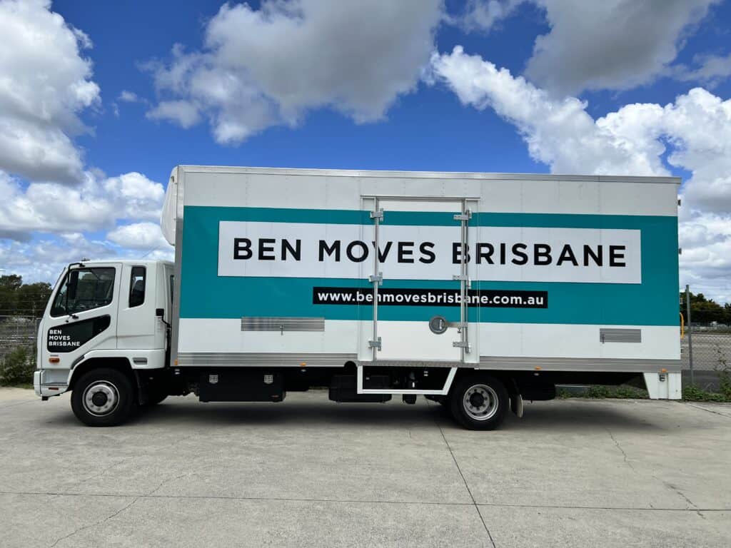 A large moving truck parked on concrete