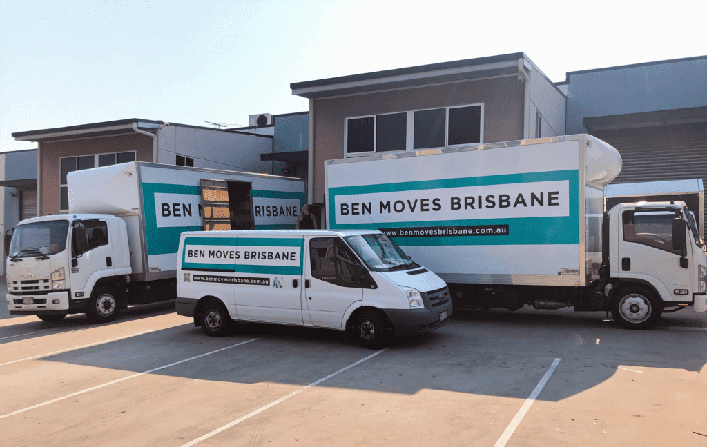 Two moving trucks and one moving van moving offices